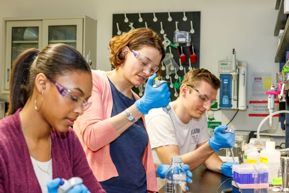 Chemistry students and faculty working in a lab