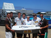 The Villanova team proudly displays its unmanned boat at the first annual International Autonomous Surface Vehicle Competition in San Diego.