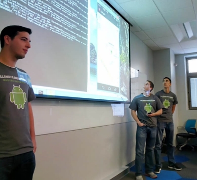 Demonstrating their “GoingOn” app are senior Computer Engineering majors Matt Wiedmeier, Matt Doyle and Ed Condon.