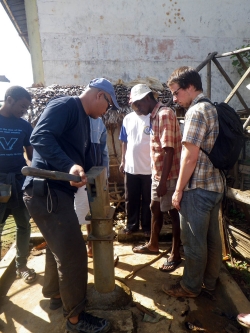 Sean Carney ’16 ME works with CRS engineer Hery Lanto Rasaonina to dismantle and examine a broken hand pump.