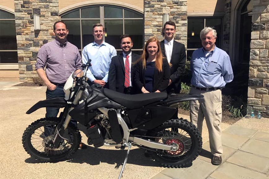 Sponsor Steve Christini ’95 ME with members of the Christini Electric Hybrid AWD Motorcycle team and team advisor Dr. Philip McLaughlin, professor emeritus.