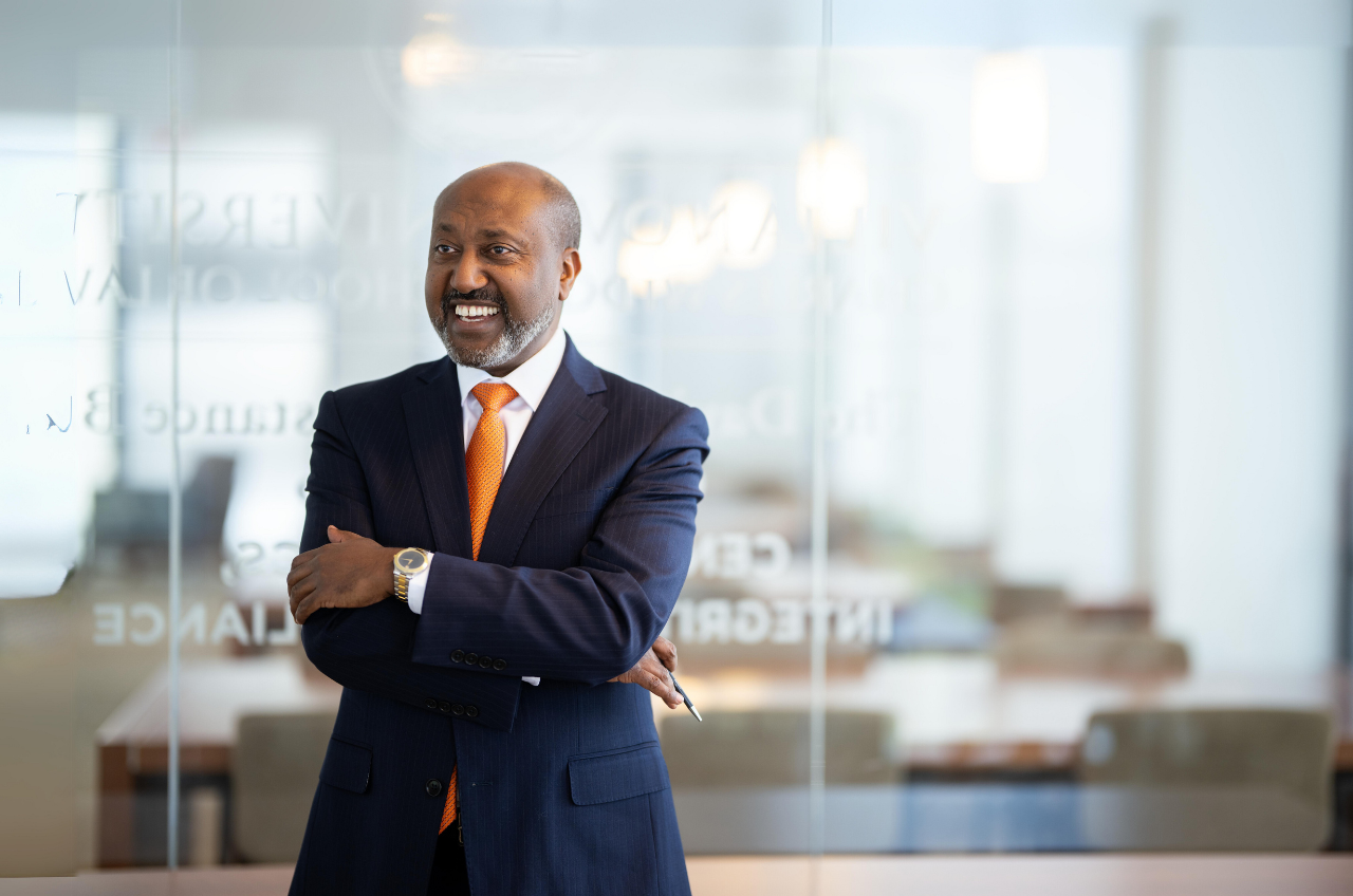 man in a business suit smiling