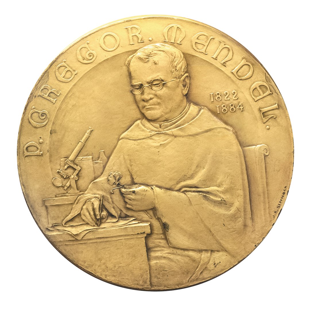 Mendel Medal, a gold coin with Gregor Mendel wearing the Augustinian habit examining a sweet-pea with a microscope beside him
