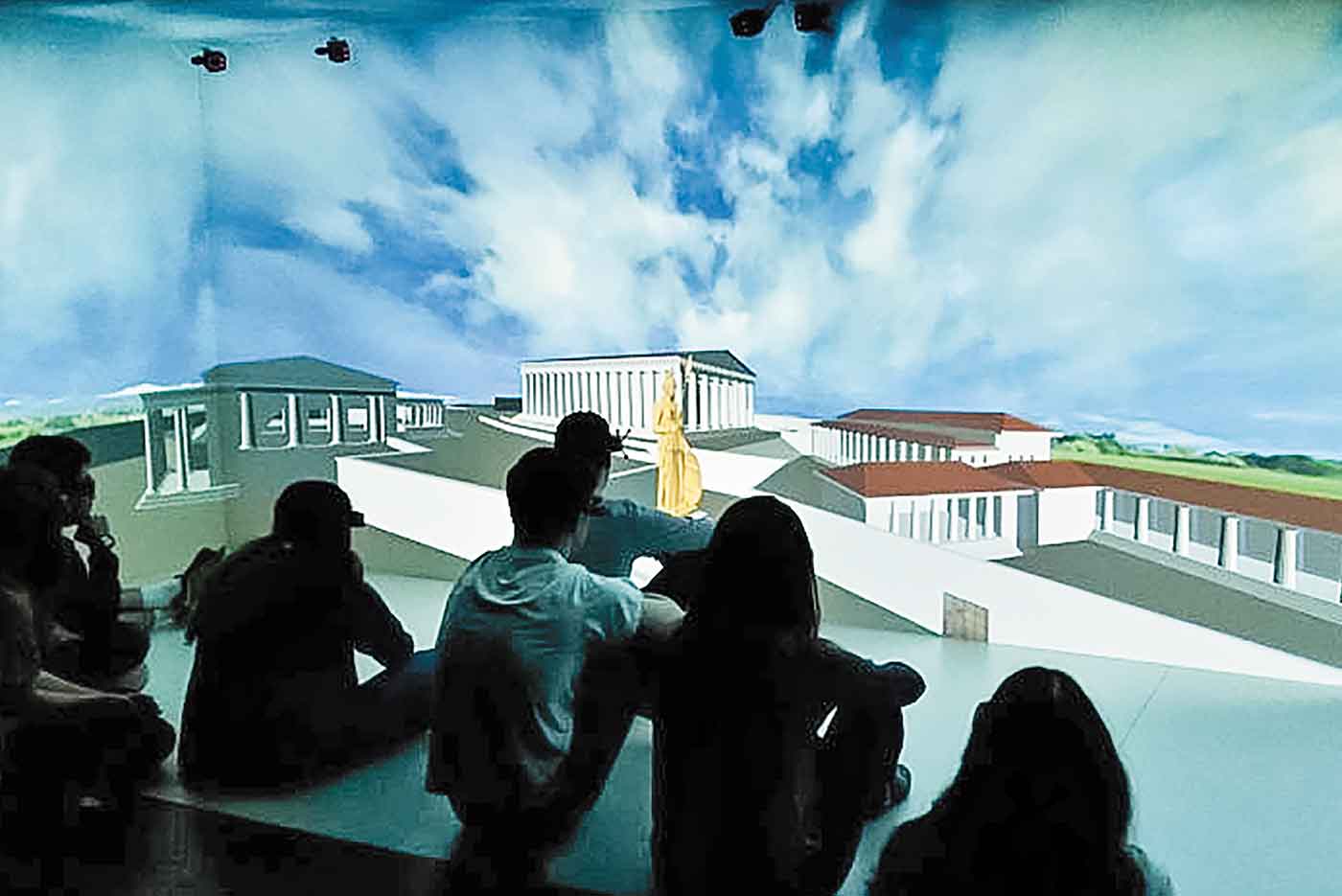 Students look at a large-screen projection of the Athenian acropolis in Minecraft
