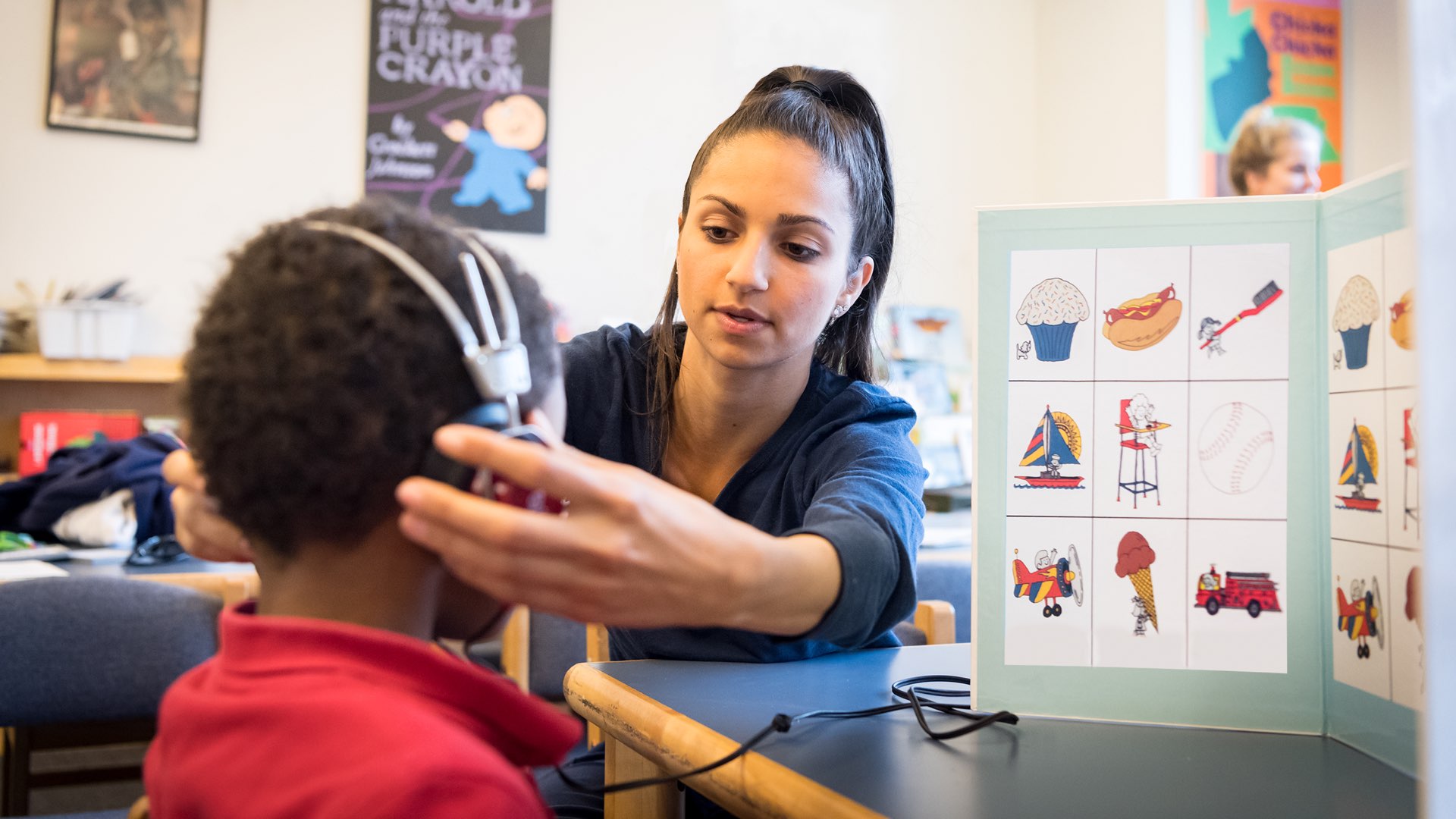 A Villanova nursing student tests a child’s hearing.