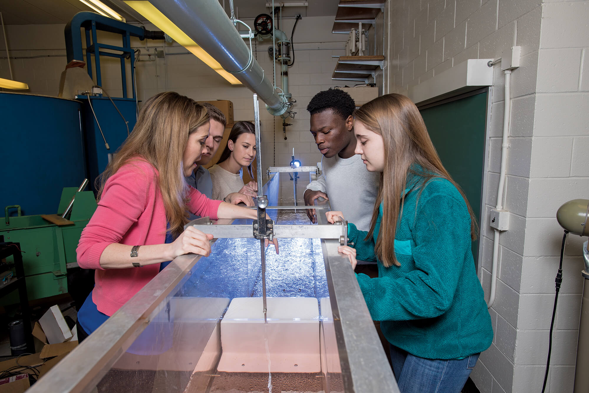 students and professor in hands-on science class