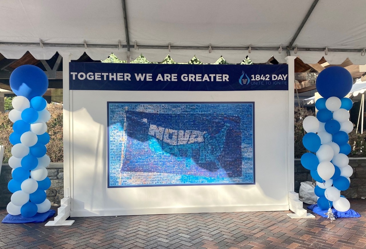 Mosaic image of a Nova Nation glad with blue and white balloons on either side, and a banner with the words "Together we are Greater"