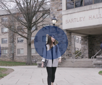 Thumbnail of student walking outside Bartley hall. Picture links to youtube video of Dan-Tom Fund.