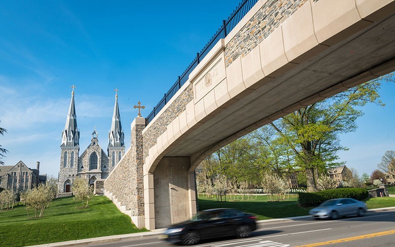 A view of the Villanova Church with the pedestrian bridge in the foreground. 