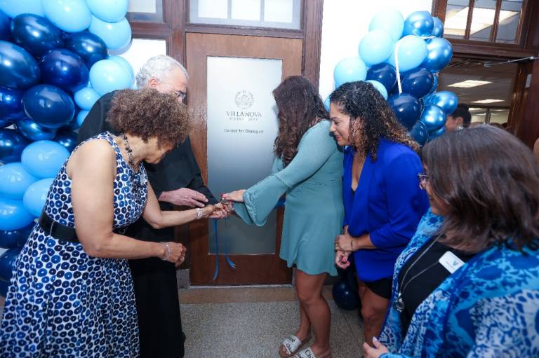 The Rev. Peter M. Donohue, OSA, PhD, Terry Nance, PhD, Sherry Bowen, PhD, Celina Alexander and Caden Lorenzini cut the ribbon at the opening of the Center for Dialogue