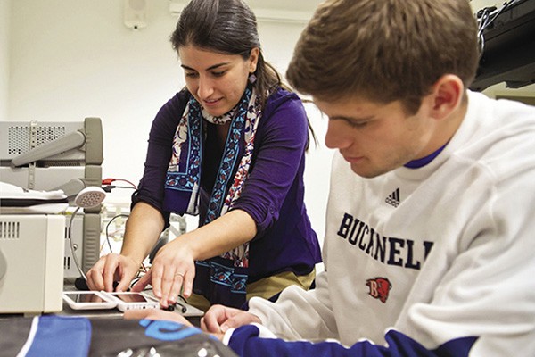 Amal Kabalan Amal Kabalan, assistant professor at Bucknell University, works with a student in the lab.