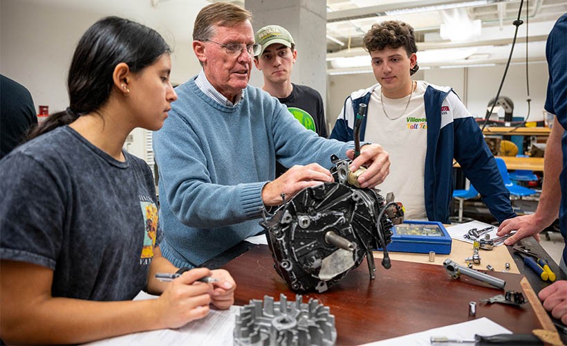 Bachelor of Science in Mechanical Engineering Students work on an engine with Professor Jim O'Brien.