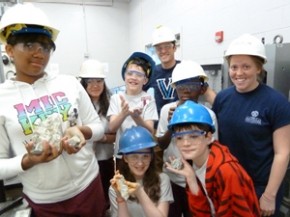 Villanova student working with NovaCANE participants with hard hats on