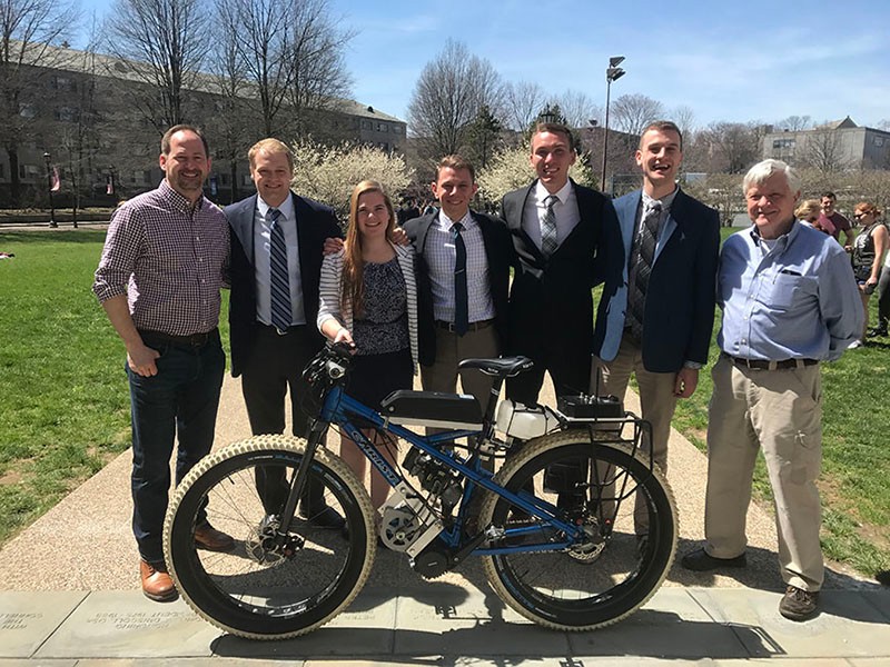 Senior Mechanical Engineers posing with fatbike