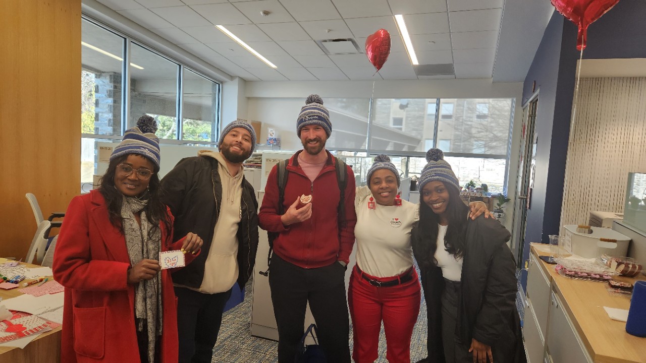 Graduate and law students celebrating at Valentine's Day event.