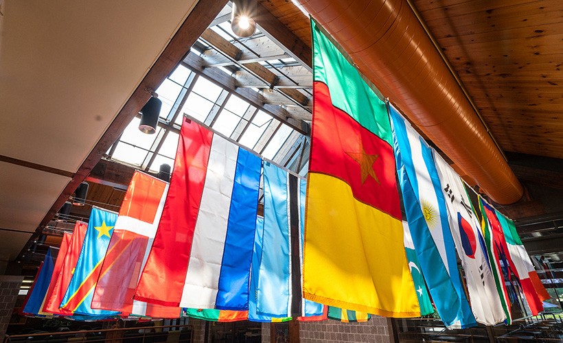 Flags from across the world hang from the ceiling in the Connelly Center.