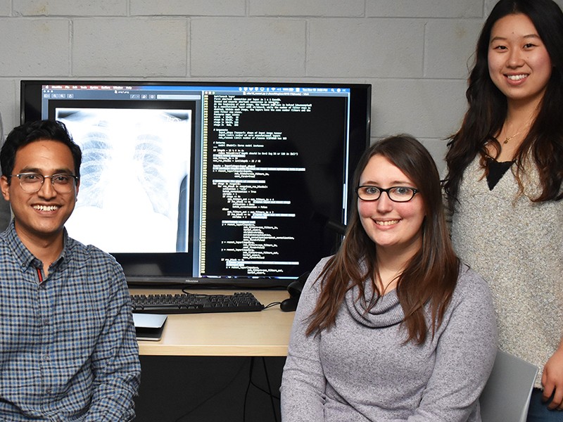 Jessica Yarnall '20 MS (seated, right) was part of a Villanova research team that trained artificial intelligence to recognize warning signs in chest X-rays.