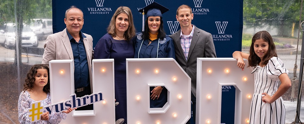 Ligia Vail '24 MS graduated this May from the Villanova master's degree program in Human Resource Develpment. (From left): daughter Isabel; father, Jairton Ribeiro; mother, Elena Ribeiro; Vail; husband, Ted; and daughter Elena.