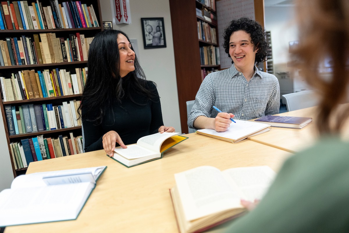 student-research A graduate student and a faculty member interact in a classroom.