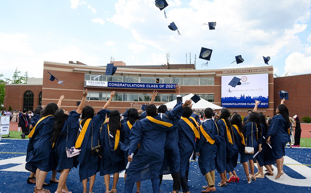 Graduates throwing their caps into the air