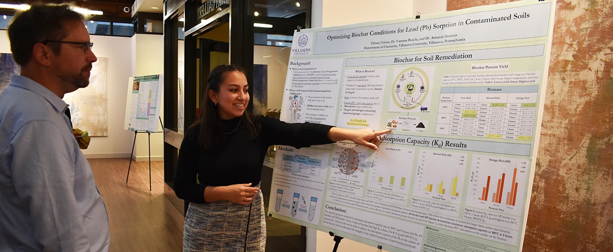 Graduate student presenting her research poster