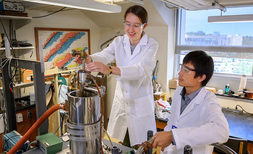 Two students work in the lab.