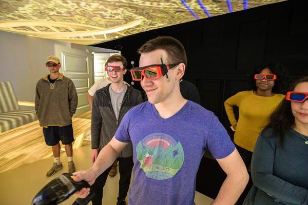 Students run simulation in the virtual reality CAVE.