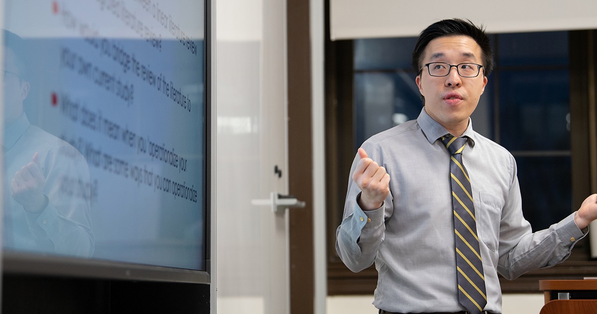 Counseling faculty teaching his class Counseling faculty teaching his class