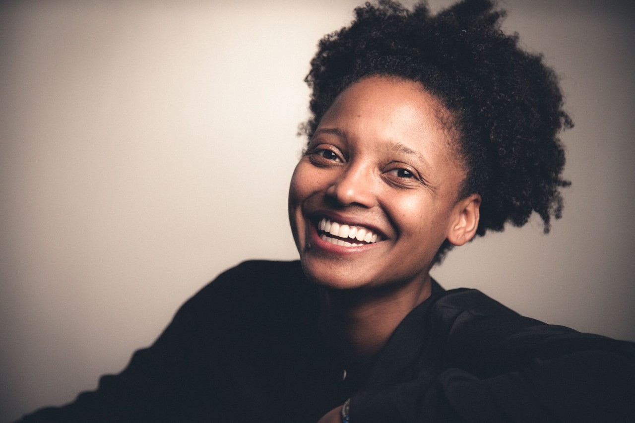 The writer Tracy K. Smith smiling at the camera