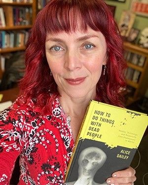 Alice Dailey holds her recently published book