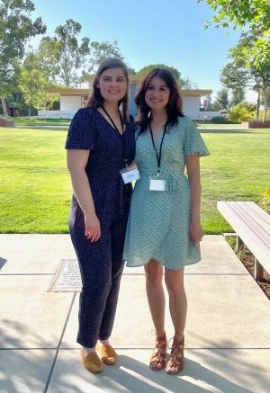 Hannah Kahn and Caitlin Salomon, grad students at a conference