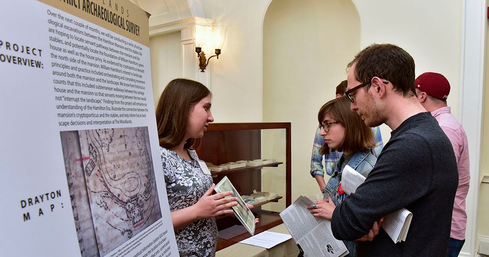 Graduate students describing a public history project