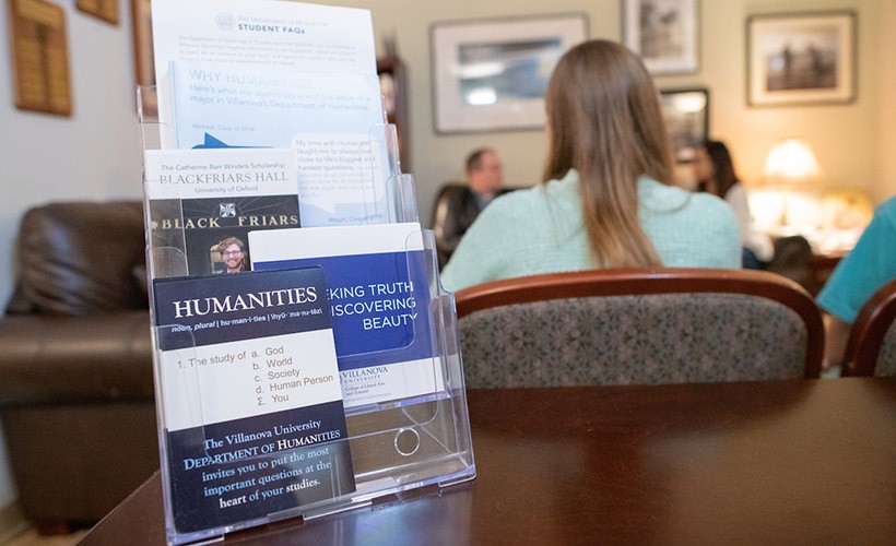 Humanities brochures and materials displayed on a table.