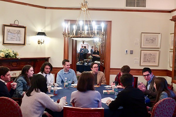 Students eat together at a Paideia Seminar.
