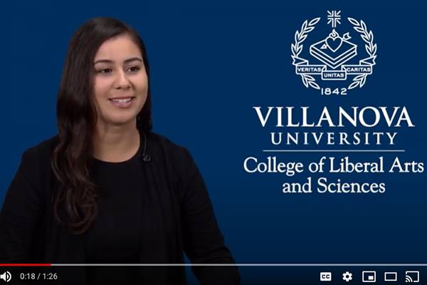 image of woman in front of blue background with Villanova U. CLAS logo
