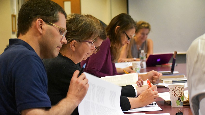 Graduate students and faculty in theology seminar