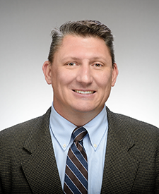 A portrait of historian Mark T. Johnson.