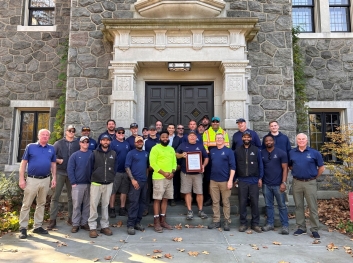 Villanova University's Grounds Department celebrates their recent awards at Stoneleigh garden.