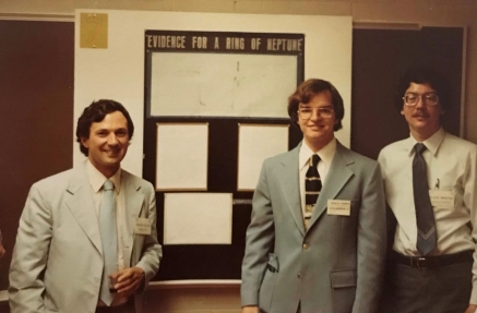 Astronomy student Craig Harris proudly stands in front of his poster presentation at the 1982 American Astronomical Society Meeting, flanked by faculty researchers Dr. Edward Guinan and Dr. Frank Maloney