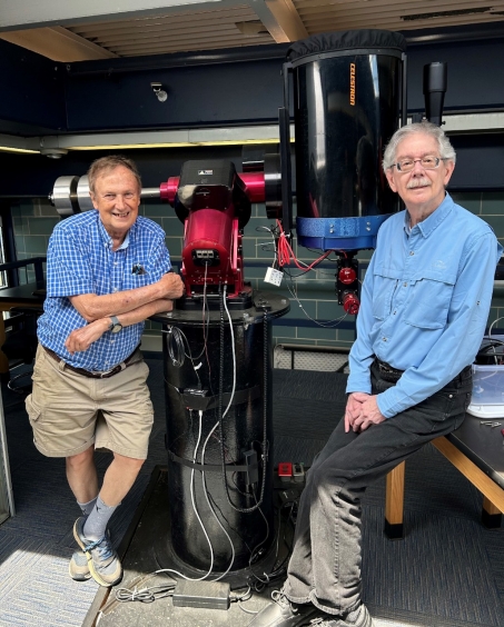 Dr. Guinan and Dr. Maloney pose next to the telescope in the George P. McCook Observatory in Mendel Hall in Summer 2024