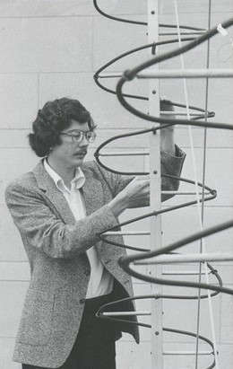 Dr. Maloney inspects radio astronomy equipment on the roof of Villanova's Mendel Hall in 1977.