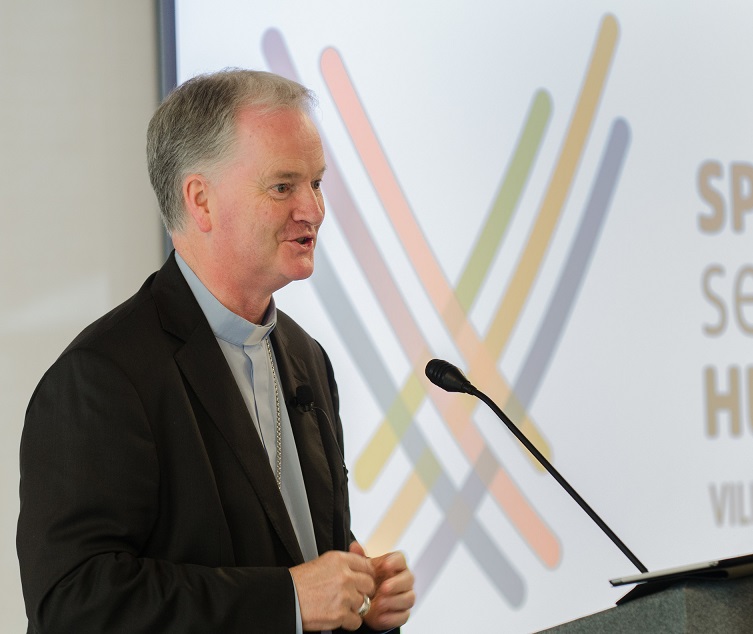 Image of Bishop Paul Tighe speaking at conference