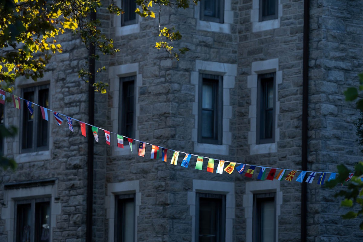 Image of world flags strung across campus
