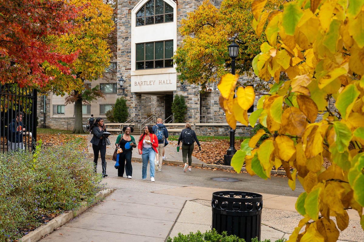 People walking through campus during Fall