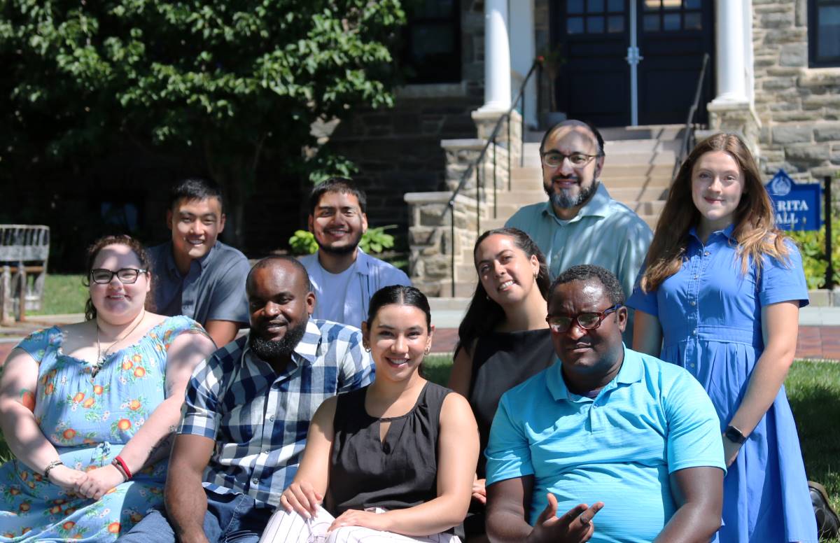 Graduate resident ministers smiling at camera