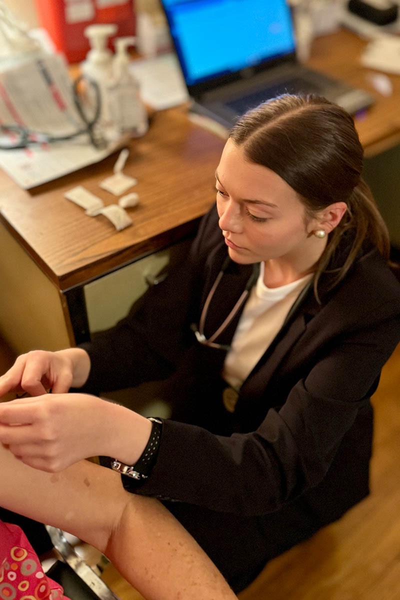 unity-clinic-2 A student volunteer taking vitals