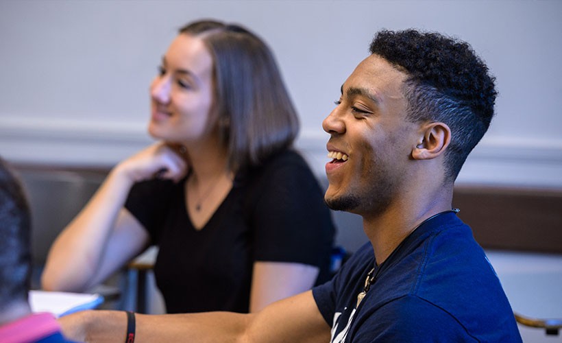 Students share a laugh in class
