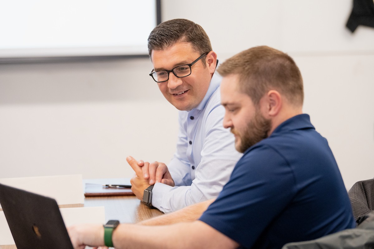 Graduate Students Working Together in Classroom