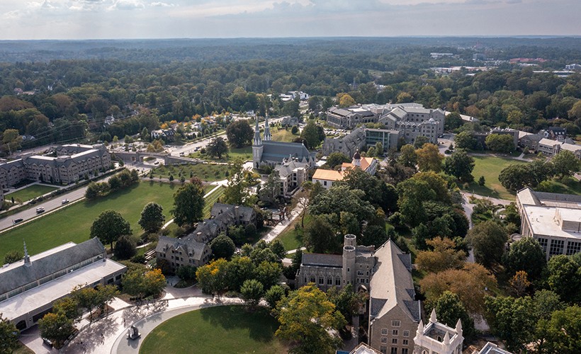 Student Walks By Grotto Student Walks By Grotto