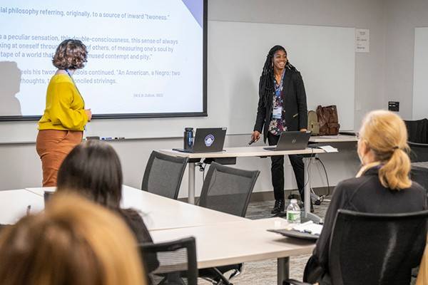 presenters speaking at a conference